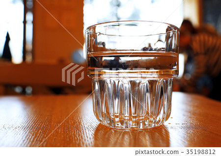 A glass is on the table A glass is on the table 35198812