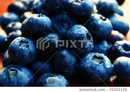 fresh berries blueberries close-up scattered 35201158