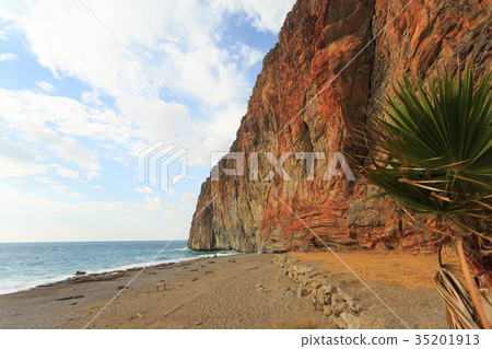 Seascape with red tock by the sea  35201913