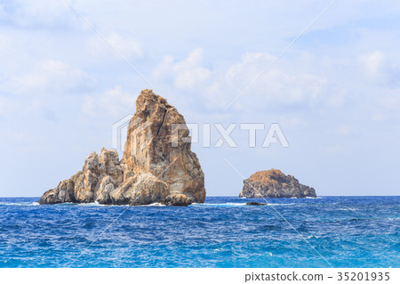Seascape with rock islands in the water Seascape with rock islands in the water 35201935