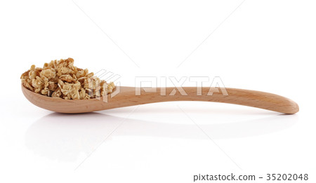 granola close up isolated on white background. granola close up isolated on white background. 35202048