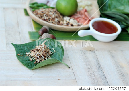 Miang Kham - leaf wrap appetizer is delicious. Miang Kham - leaf wrap appetizer is delicious. 35203557