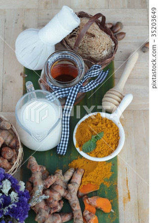 Turmeric powder with honey and milk for scrub. Turmeric powder with honey and milk for scrub. 35203649