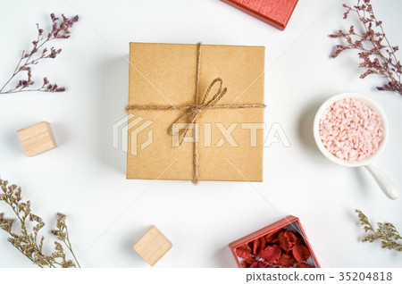 Brown gift box with bow tie, And grass flower. Brown gift box with bow tie, And grass flower. 35204818