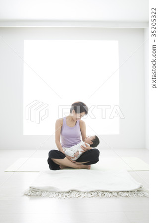 Mother doing yoga with baby 35205322