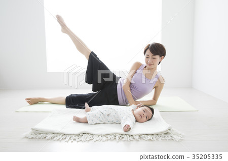 Mother doing yoga with baby Mother doing yoga with baby 35205335