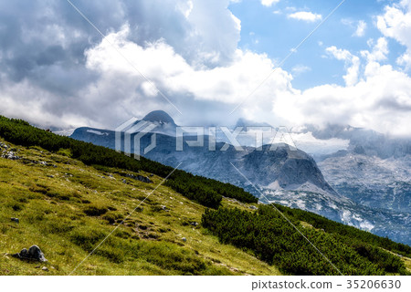 Scenic view of alps mountains a sunny day Scenic view of alps mountains a sunny day 35206630