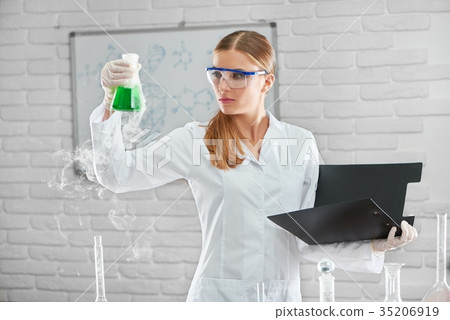 Female chemist working at the laboratory 35206919