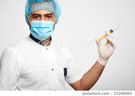 Male doctor posing at studio Male doctor posing at studio 35206983