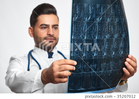 Male doctor posing at studio Male doctor posing at studio 35207012