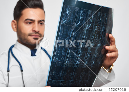 Male doctor posing at studio Male doctor posing at studio 35207016