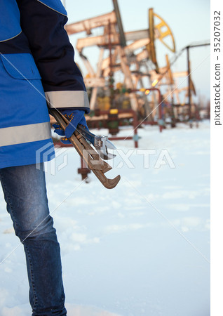 Oil worker hand. 35207032