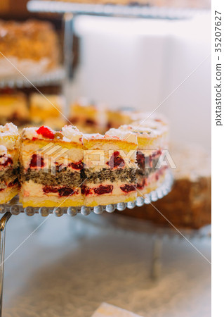 Close-up view of the delicious cake with cherries Close-up view of the delicious cake with cherries 35207627