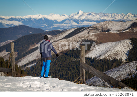 Walking in the snow. 35208071