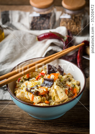 Risotto with chicken and vegetables. Risotto with chicken and vegetables. 35208472