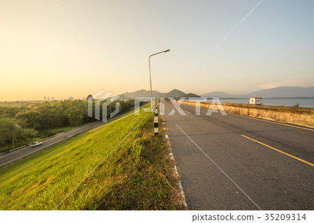 road on dam or reservoir on sunset time road on dam or reservoir on sunset time 35209314