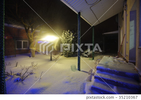 Snow covered garden in the backyard, winter night Snow covered garden in the backyard, winter night 35210367