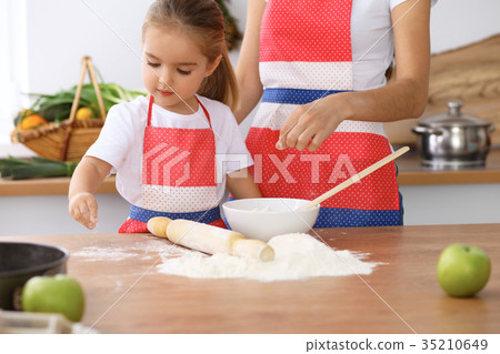 Happy family in the kitchen. Mother and child Happy family in the kitchen. Mother and child 35210649