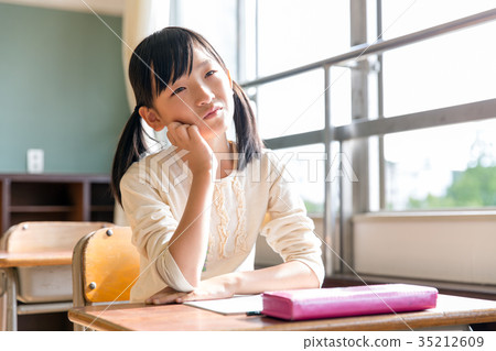Troubled primary school girl girl studying Troubled primary school girl girl studying 35212609