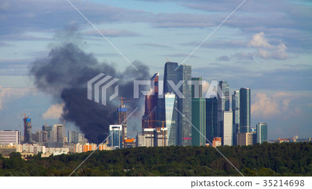 Black smoke over burning residential building 35214698