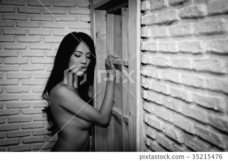 Portrait of young woman brunette with beautiful nude topless bre Portrait of young woman brunette with beautiful nude topless bre 35215476