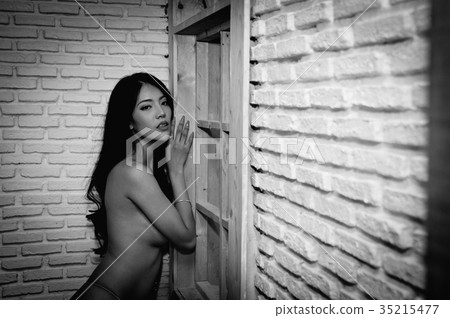 Portrait of young woman brunette with beautiful nude topless bre Portrait of young woman brunette with beautiful nude topless bre 35215477