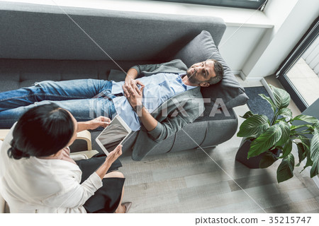 Mindful man visiting female psychotherapist Mindful man visiting female psychotherapist 35215747
