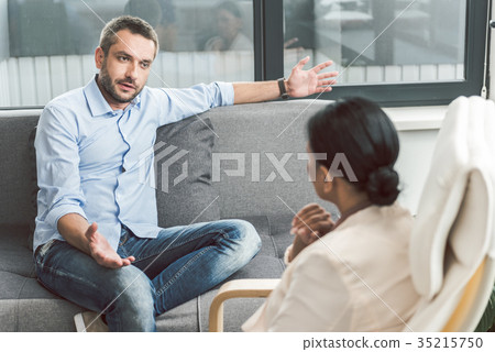Embarrassed male visitor of psychotherapist 35215750