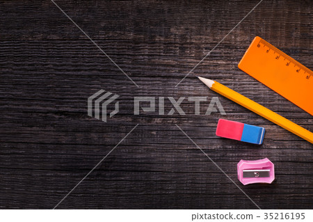 Pencil, eraser, sharpener and ruler closeup 35216195