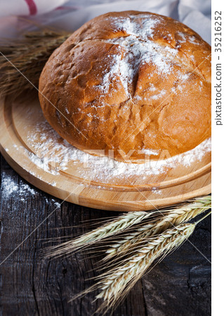 Freshly baked traditional round bread Freshly baked traditional round bread 35216252