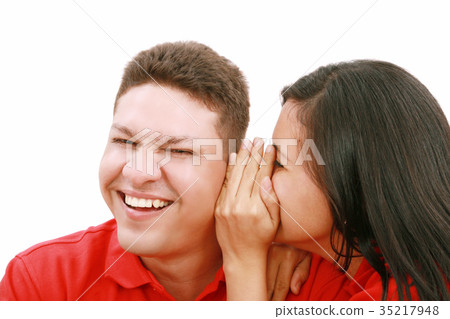 woman telling a man a secret 35217948