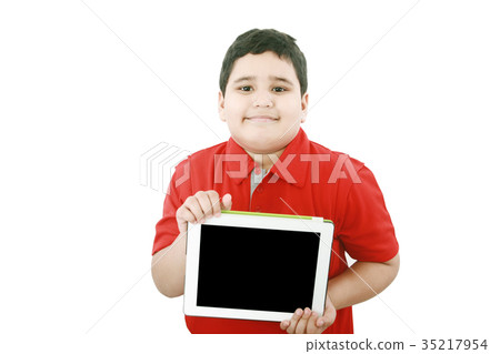 Young boy holding a tablet computer isolated Young boy holding a tablet computer isolated 35217954