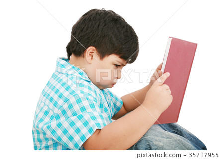 Young boy tries to do his homework 35217955