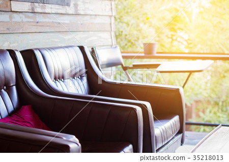close-up brown sofa in wooden house with copyspace close-up brown sofa in wooden house with copyspace 35218013