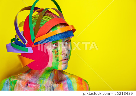 Model with colorful makeup in multicolored helmet Model with colorful makeup in multicolored helmet 35218489
