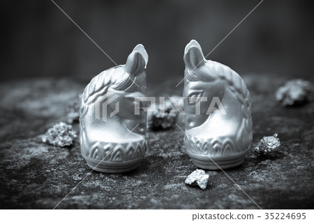 Vintage chess horse in silver on old stone floor 35224695