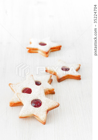 Traditional Linzer cookies - stars with red jam 35224704