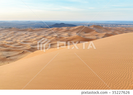 Erg Chebbi Sand dunes near Merzouga in the morning Erg Chebbi Sand dunes near Merzouga in the morning 35227626
