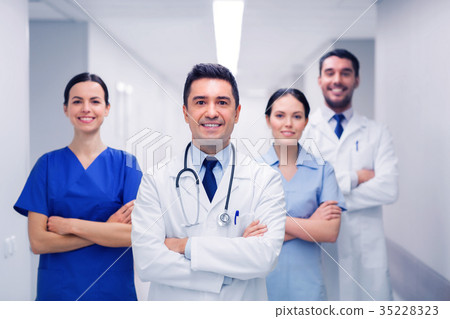 happy group of medics or doctors at hospital 35228323
