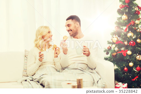 happy couple at home with christmas tree happy couple at home with christmas tree 35228842