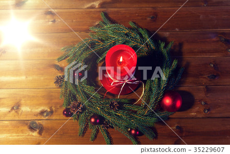 fir branch wreath with candle on wooden table fir branch wreath with candle on wooden table 35229607