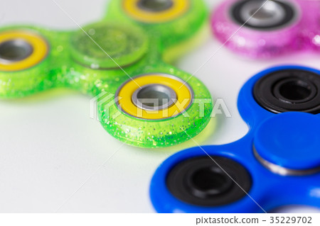 close up of fidget spinners on white background 35229702