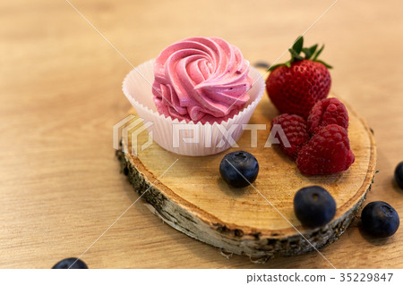 zephyr or marshmallow with berries on stand zephyr or marshmallow with berries on stand 35229847