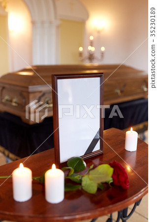 photo frame and coffin at funeral in church 35230189