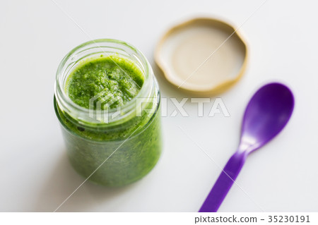 jar of vegetable puree or baby food and spoon jar of vegetable puree or baby food and spoon 35230191