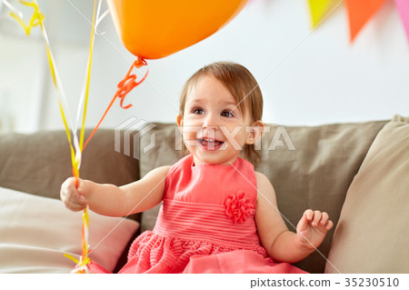 happy baby girl on birthday party at home happy baby girl on birthday party at home 35230510