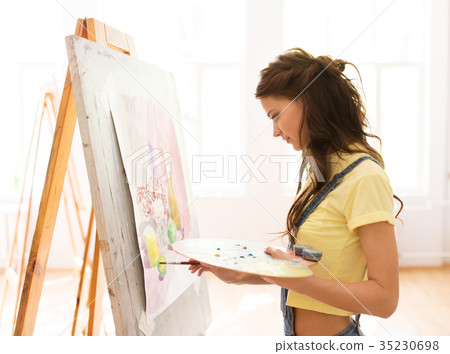 student girl with easel painting at art school student girl with easel painting at art school 35230698