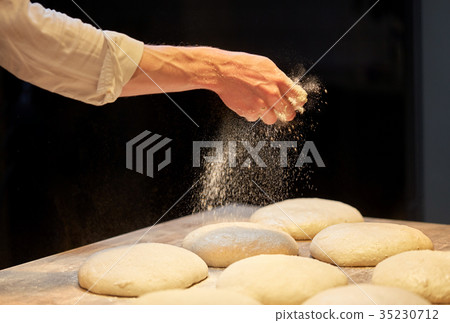 chef or baker making bread dough at bakery chef or baker making bread dough at bakery 35230712