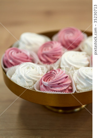 close up of zephyr or marshmallow on cake stand close up of zephyr or marshmallow on cake stand 35230713