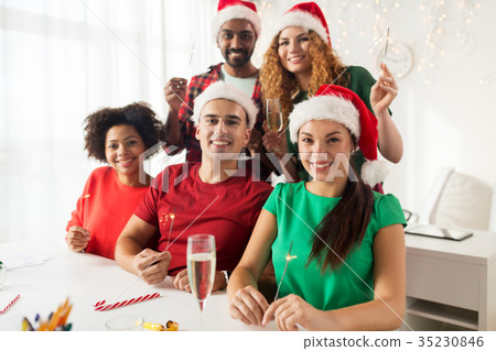 happy team celebrating christmas at office party 35230846